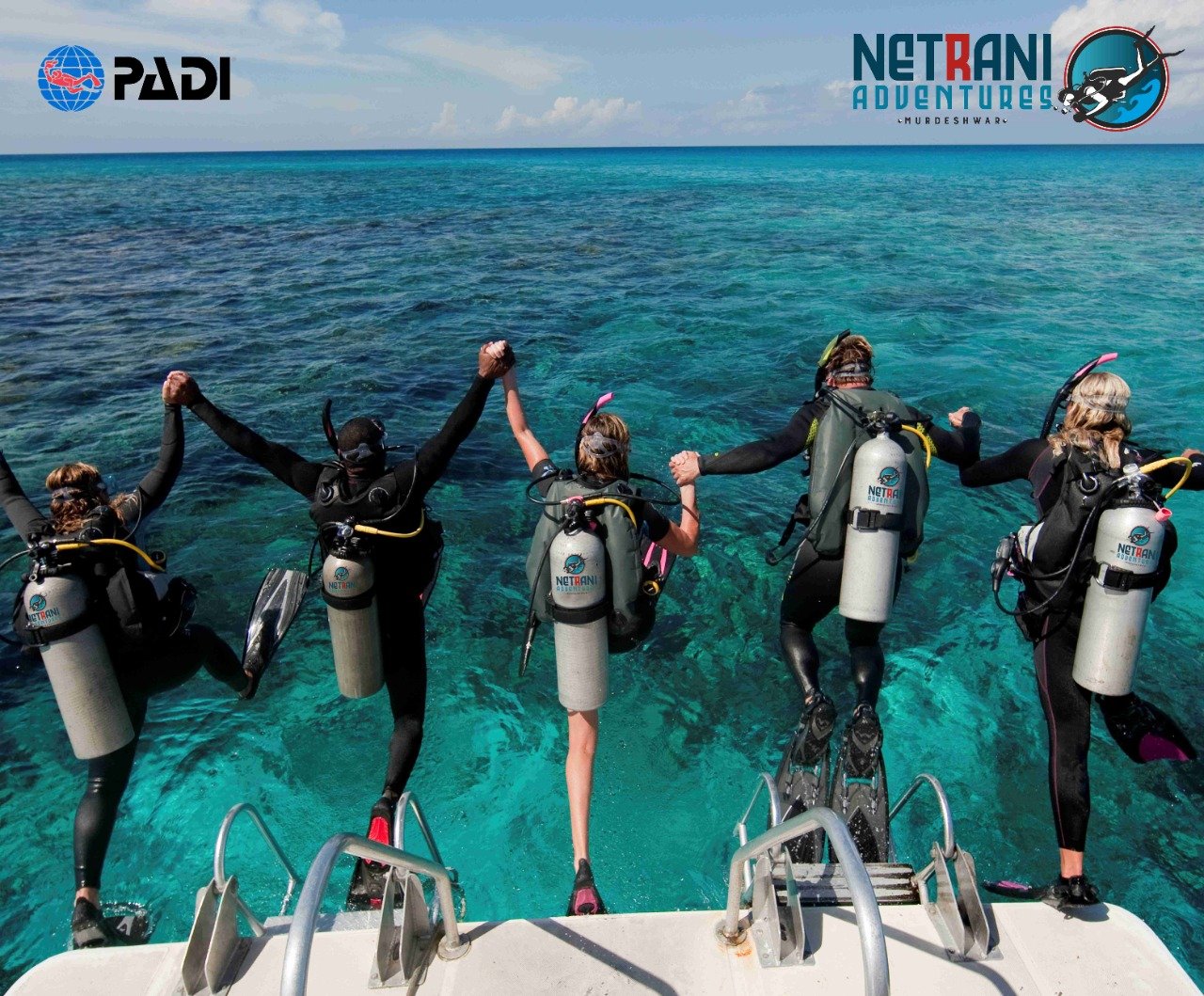 Netrani Adventures scuba divers on boat with gear